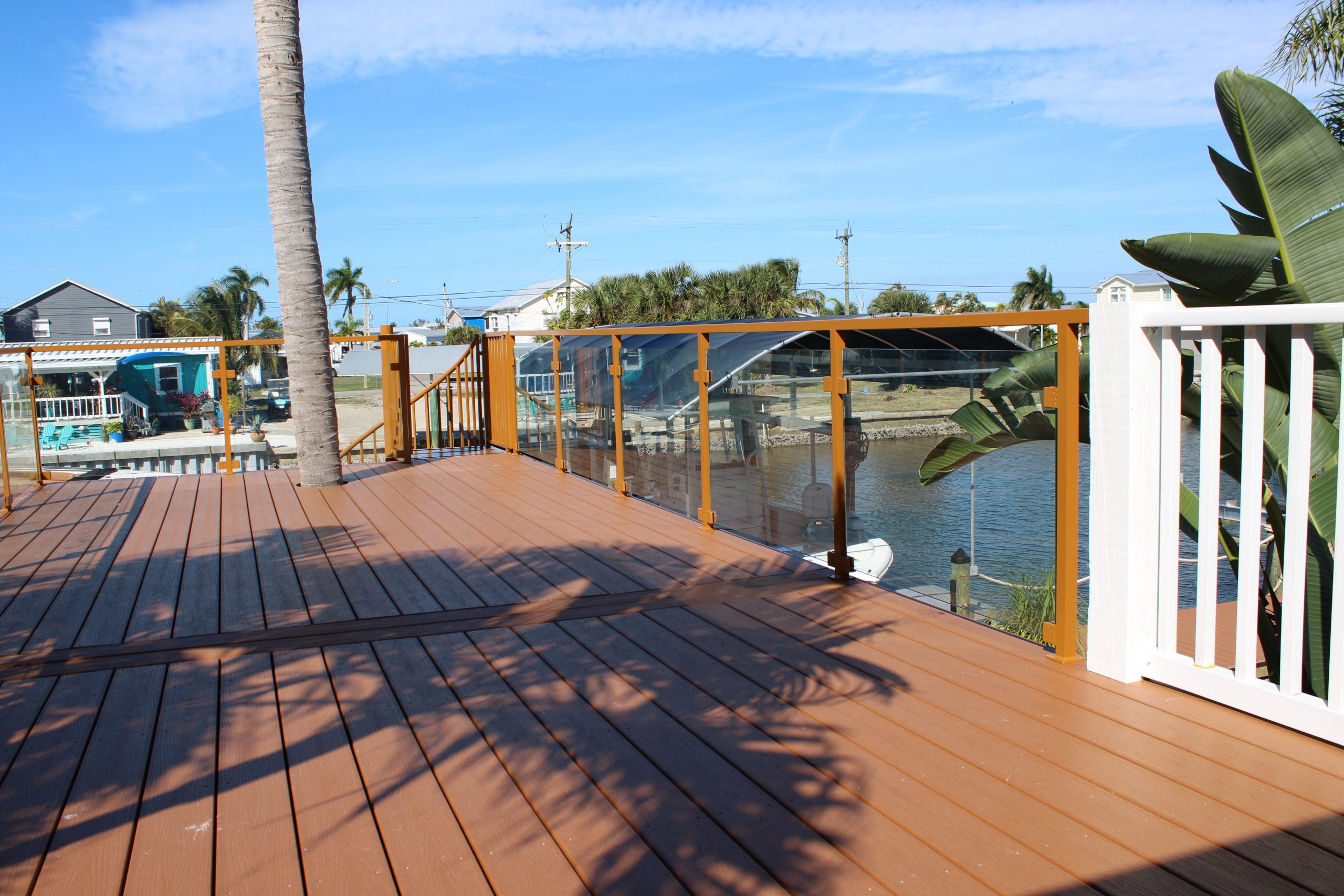 modern glass balcony railing and stair railing fabricated by AMD Ornamental LLC railing contractor and metal fabricator serving Naples Marco Island Bonita Springs Estero Fort Myers and Cape Coral Florida