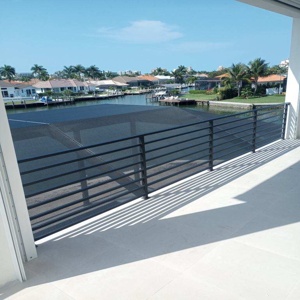 waterfront horizontal metal balcony railing fabricated and installed by AMD Ornamental LLC railing contractor and metal fabricator serving Naples Marco Island Bonita Springs Estero Fort Myers and Cape Coral Florida